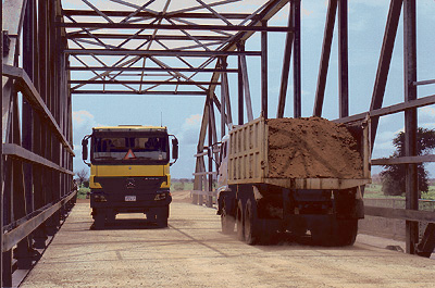 vehicles crossing bridge photo